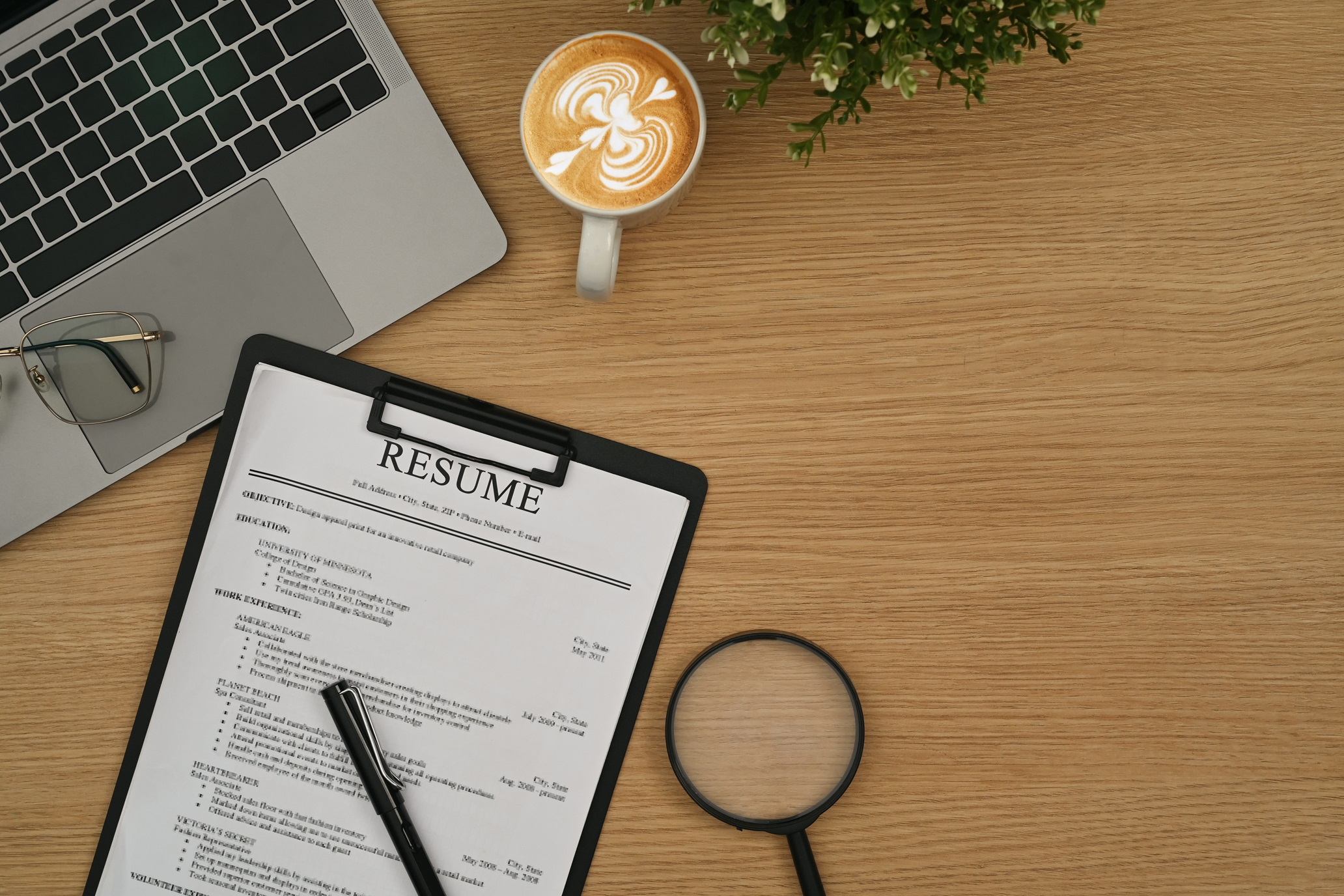 Person reviewing resume and job applications